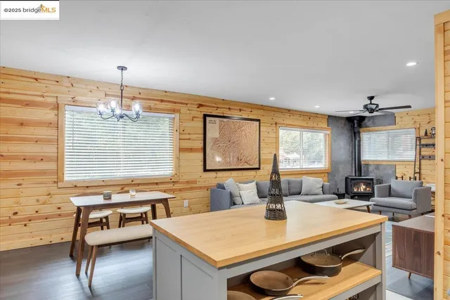 a view of a dining room with furniture and chandelier