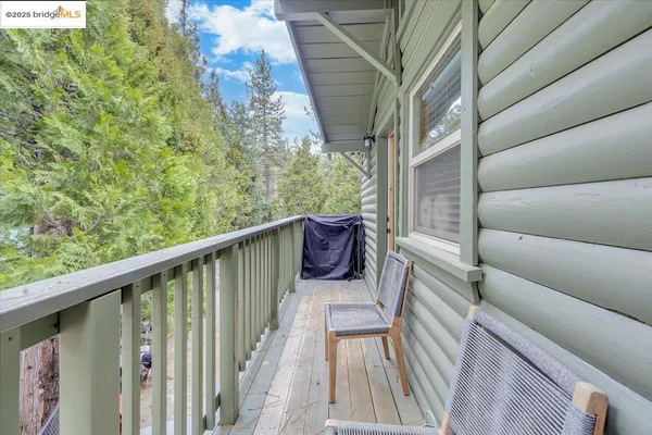 a view of balcony with furniture