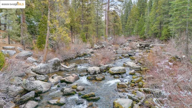 a view of a balcony with a table and chairs