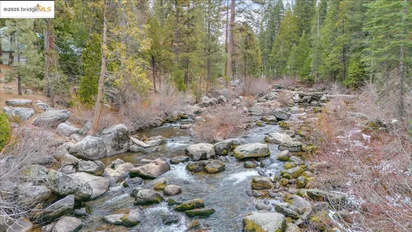 a view of a balcony with a table and chairs