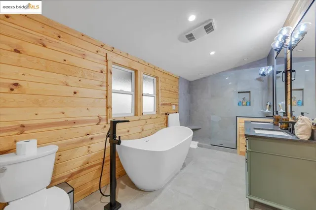 a bathroom with a sink double vanity and a mirror