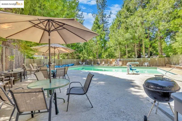 a view of yard with patio