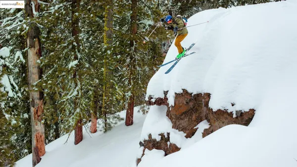 a living room with furniture a large window and a table