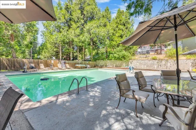 a view of a swimming pool with chairs