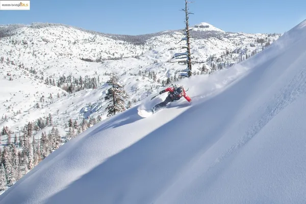 a large kitchen with a table and chairs in it
