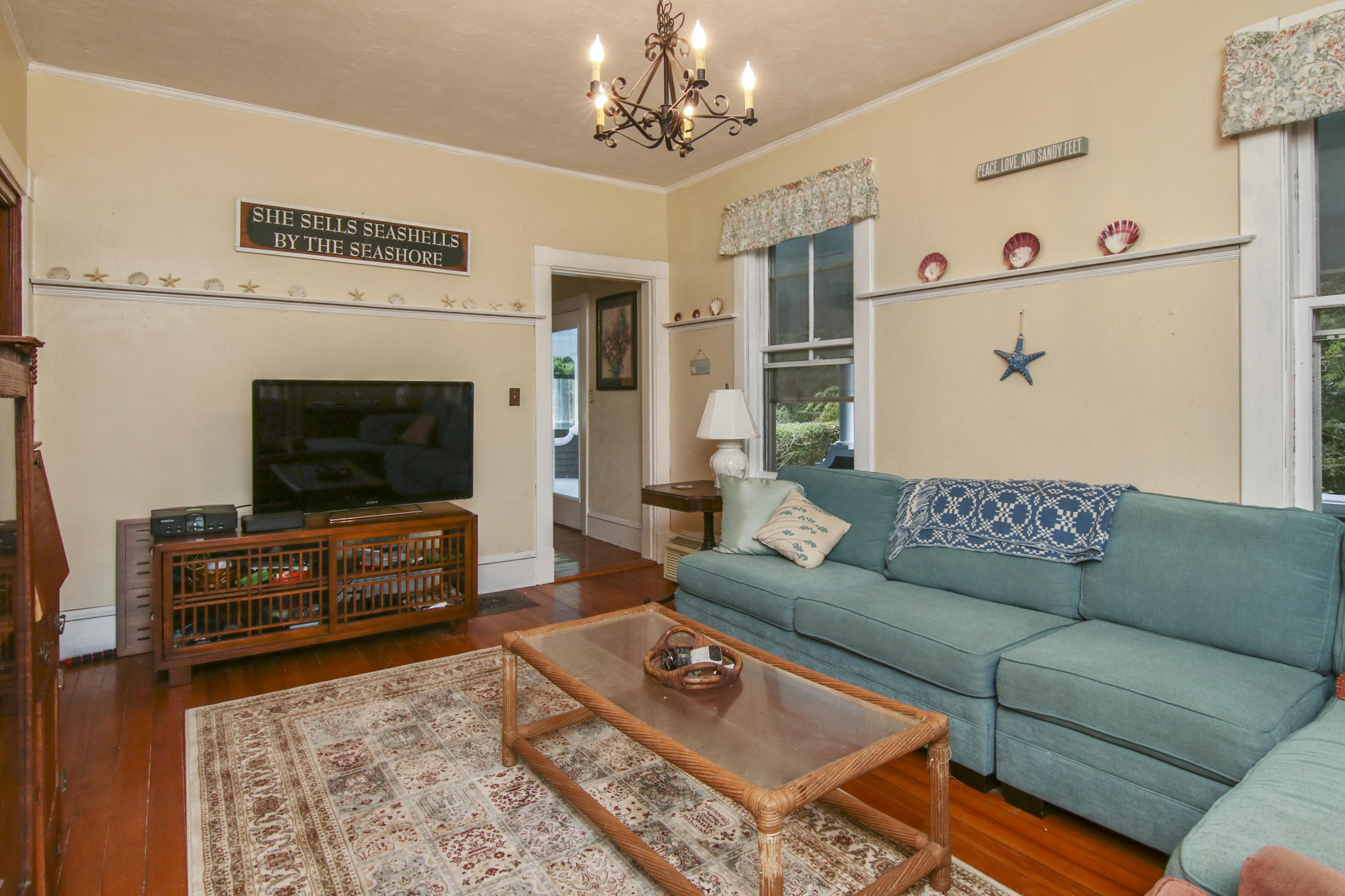 40 Red Brook Harbor Road Pocasset, MA 02559 - Photo 14 of 30 a living room with furniture and a flat screen tv