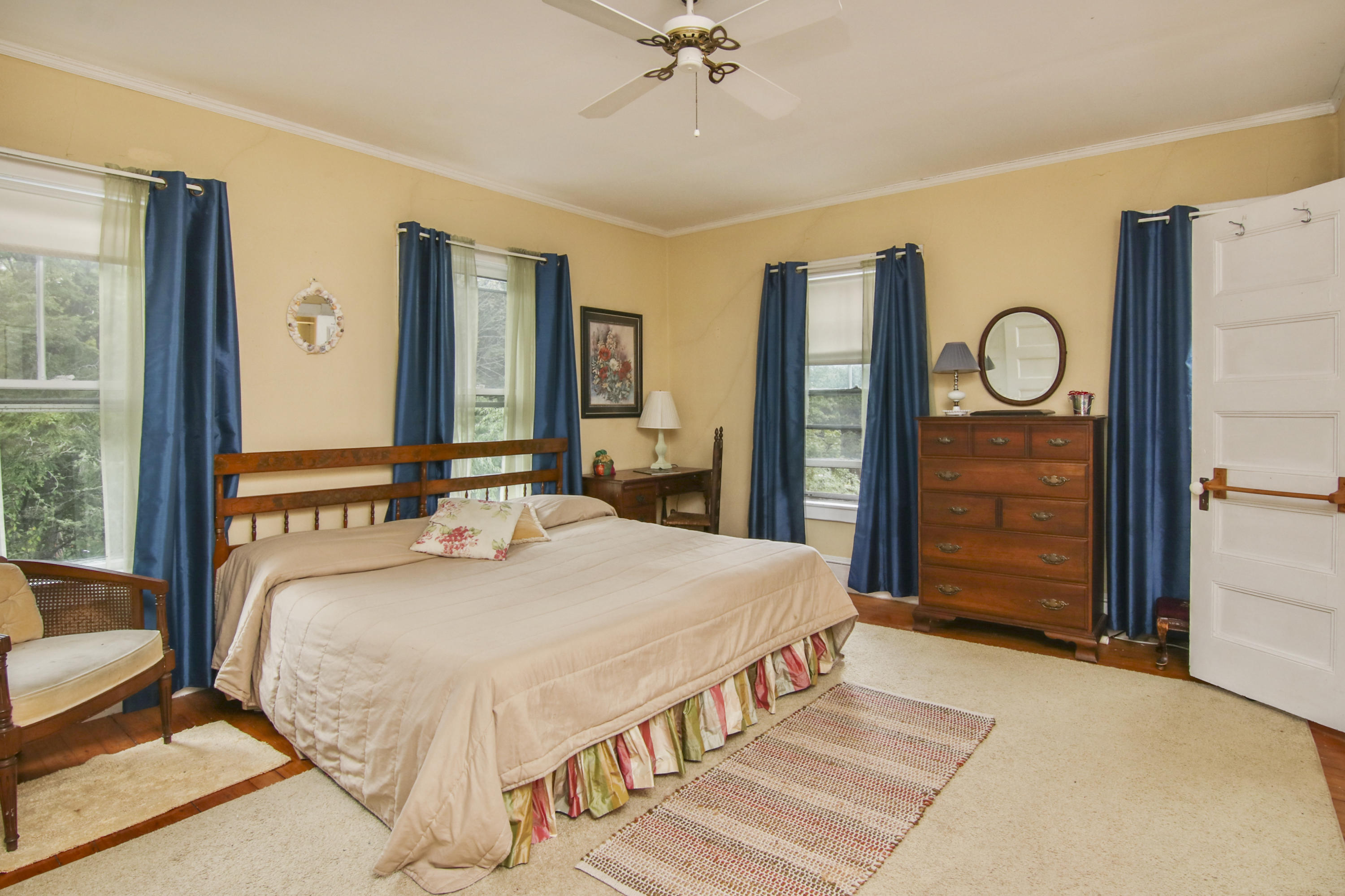 40 Red Brook Harbor Road Pocasset, MA 02559 - Photo 16 of 30 a bedroom with a large bed and a chandelier