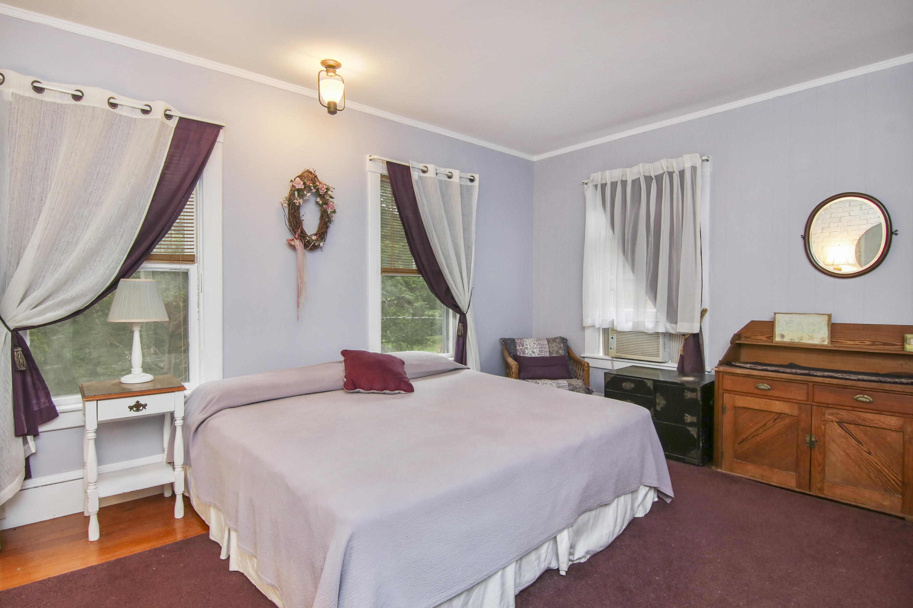 40 Red Brook Harbor Road Pocasset, MA 02559 - Photo 19 of 30 a bedroom with a bed and a large window