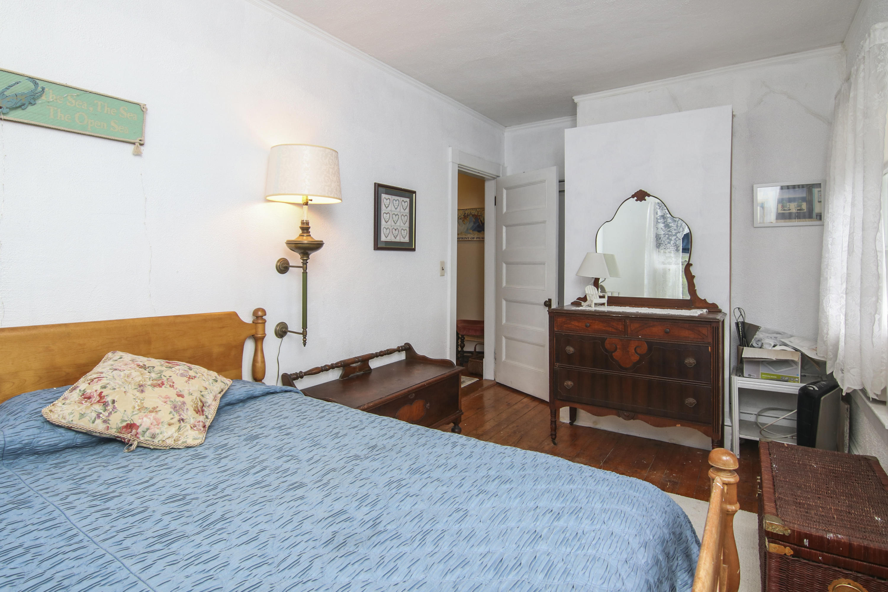 40 Red Brook Harbor Road Pocasset, MA 02559 - Photo 23 of 30 a bedroom with a bed and wooden floor