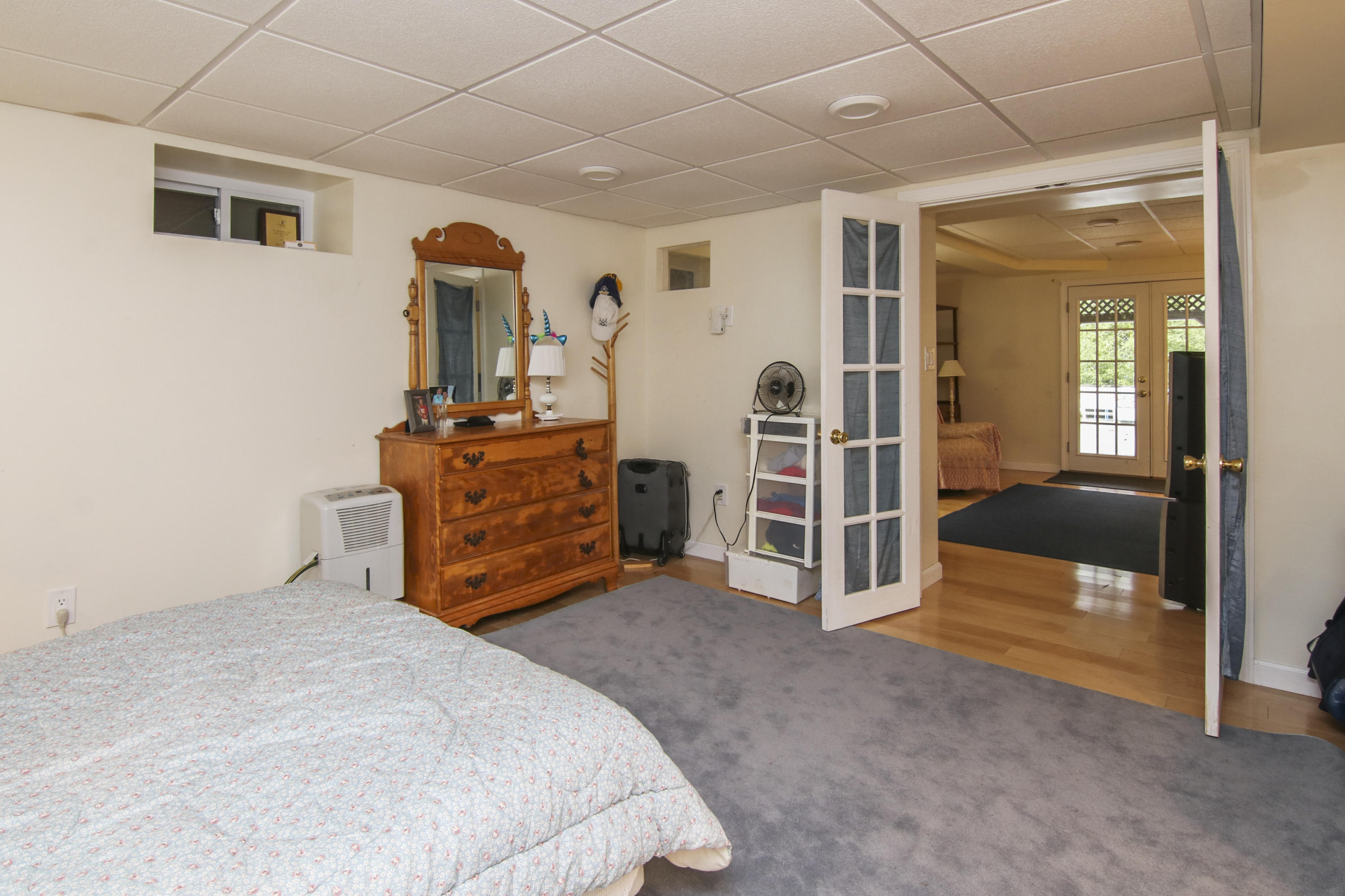 40 Red Brook Harbor Road Pocasset, MA 02559 - Photo 27 of 30 a bed room with a bed and dresser