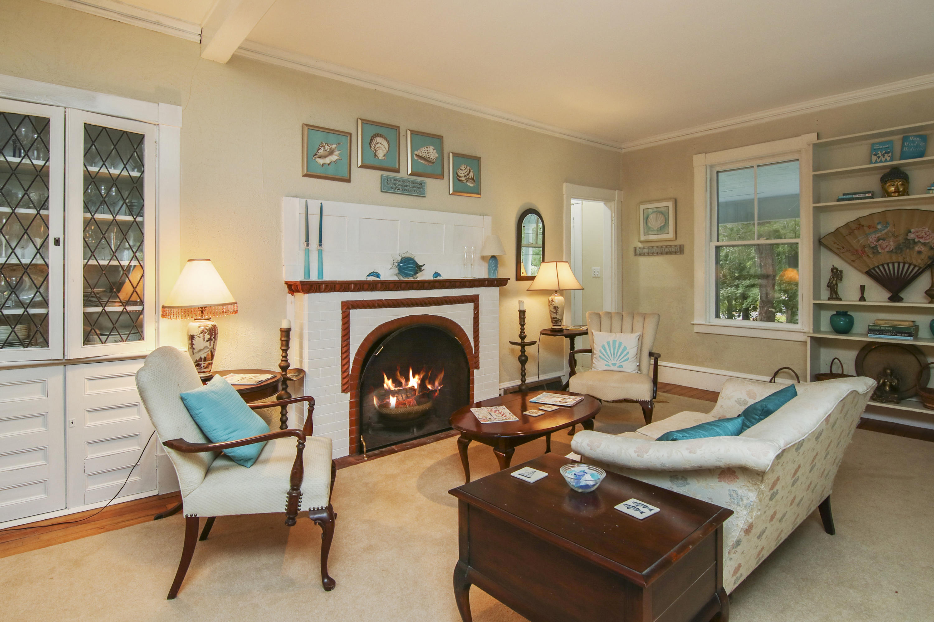 40 Red Brook Harbor Road Pocasset, MA 02559 - Photo 3 of 30 a living room with furniture a rug and a fireplace