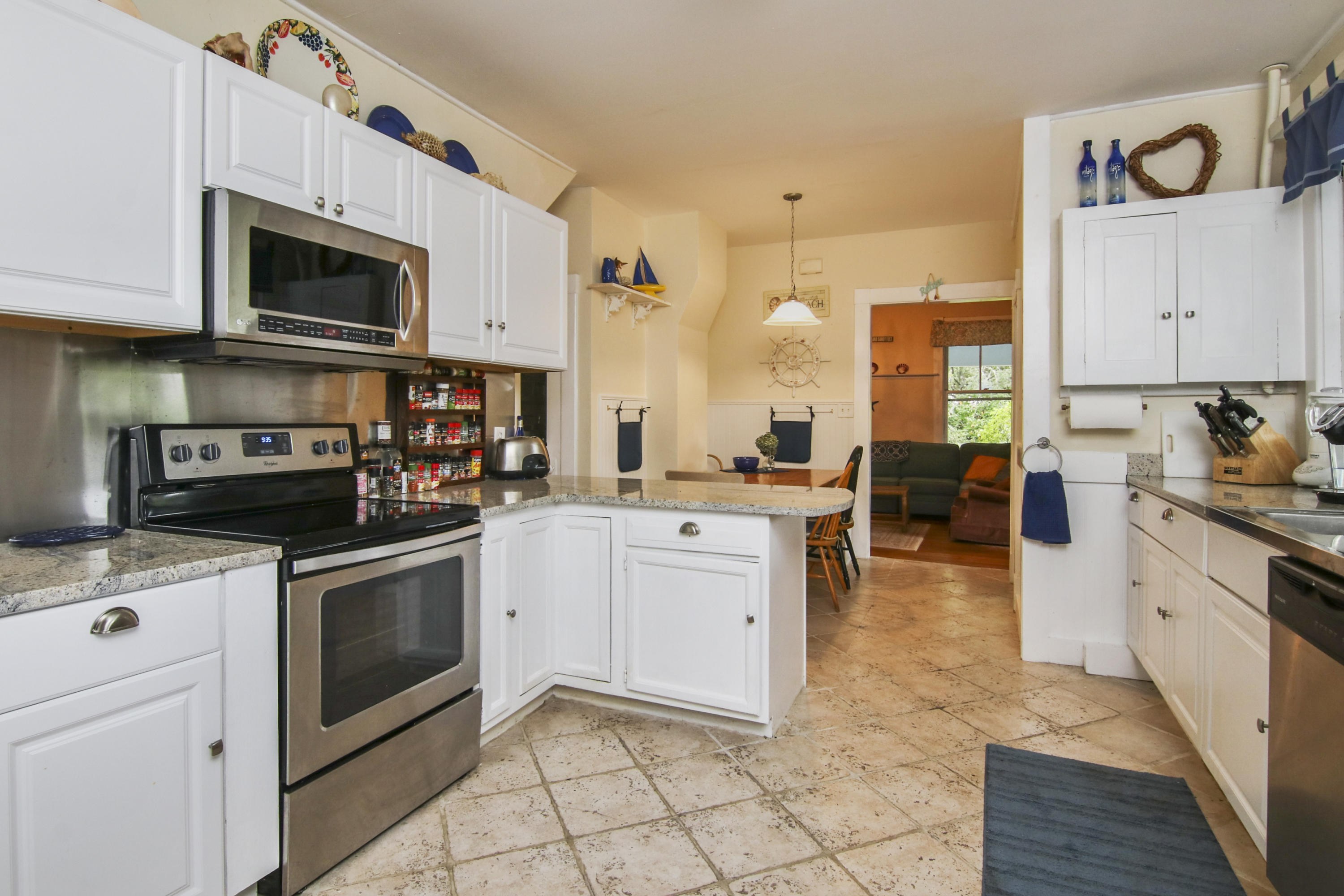 40 Red Brook Harbor Road Pocasset, MA 02559 - Photo 10 of 30 a kitchen with stainless steel appliances granite countertop a stove a sink and a microwave