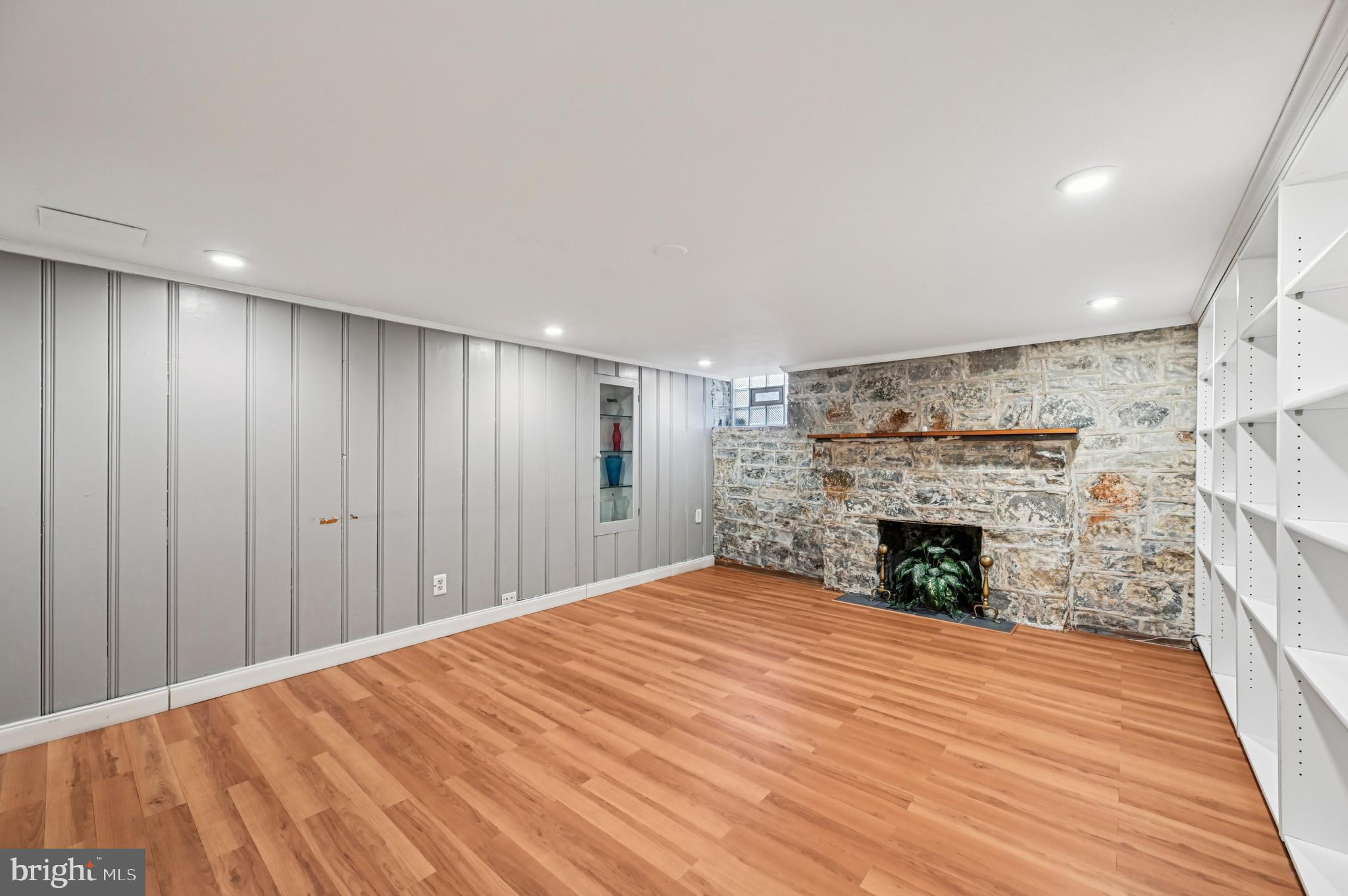 19 Somerset Road Baltimore, MD 21228 - Photo 25 of 39 a view of empty room with wooden floor and fireplace