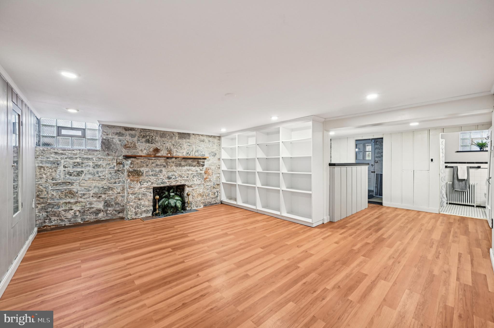 19 Somerset Road Baltimore, MD 21228 - Photo 26 of 39 a view of empty room with wooden floor and fireplace