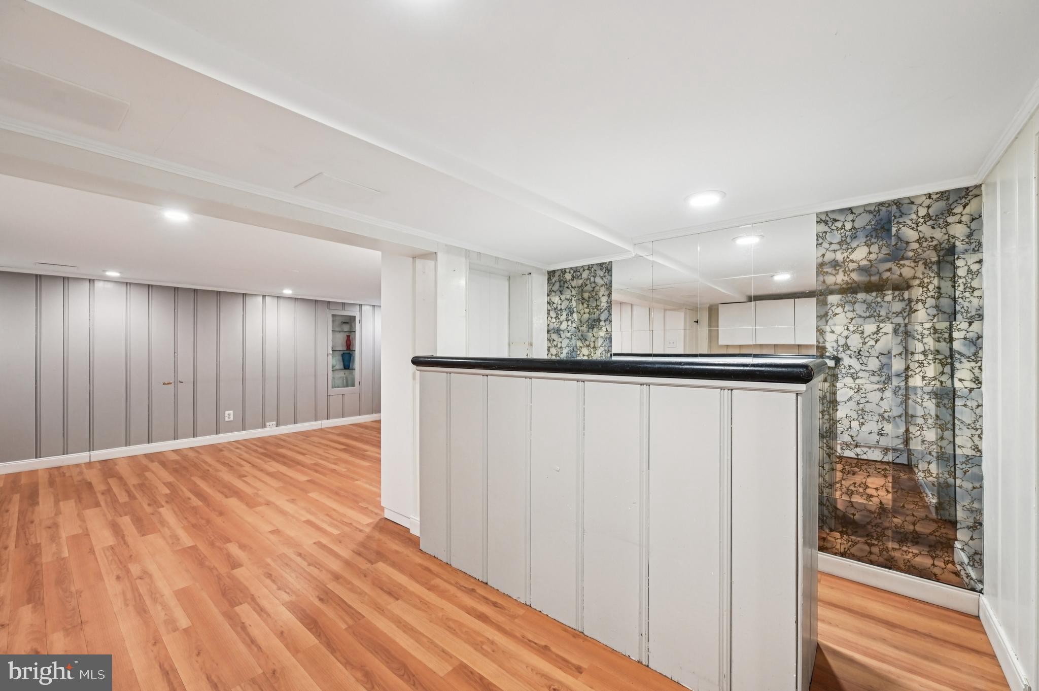19 Somerset Road Baltimore, MD 21228 - Photo 28 of 39 a view of an empty room with wooden floor