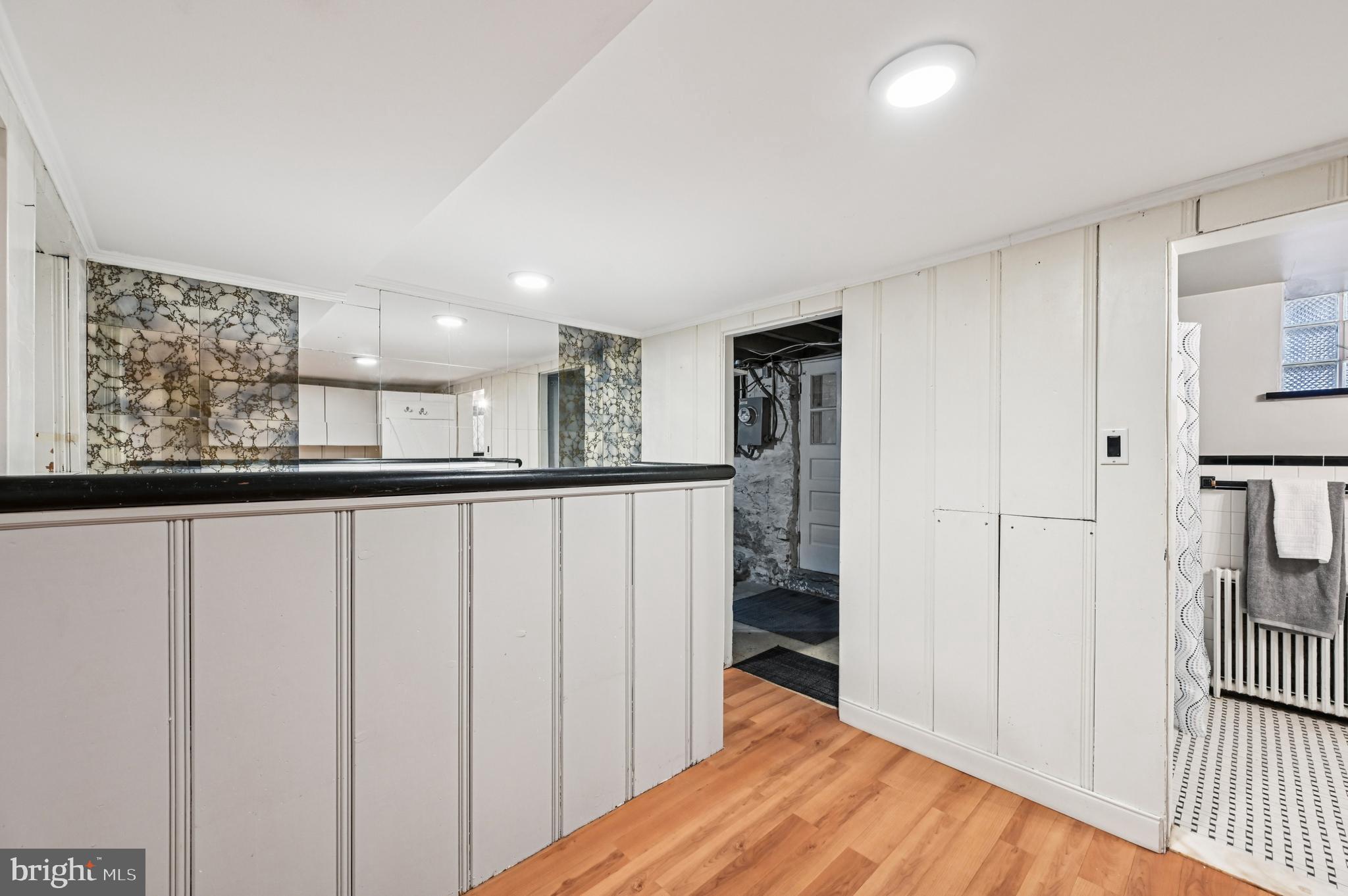 19 Somerset Road Baltimore, MD 21228 - Photo 29 of 39 a view of a hallway with wooden floor and staircase