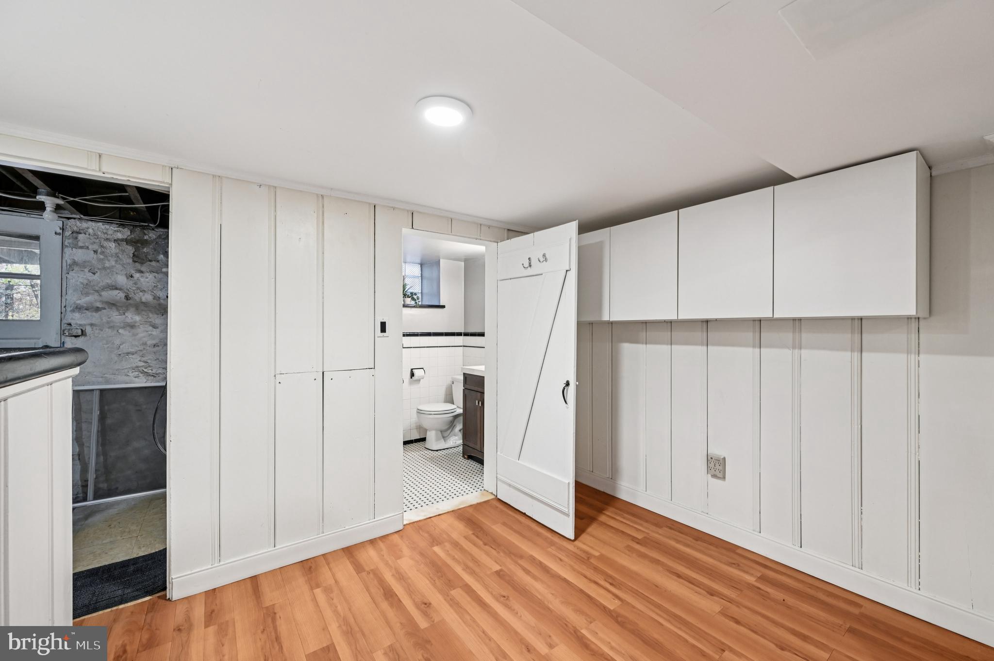 19 Somerset Road Baltimore, MD 21228 - Photo 30 of 39 a view of empty room with wooden floor and cabinet