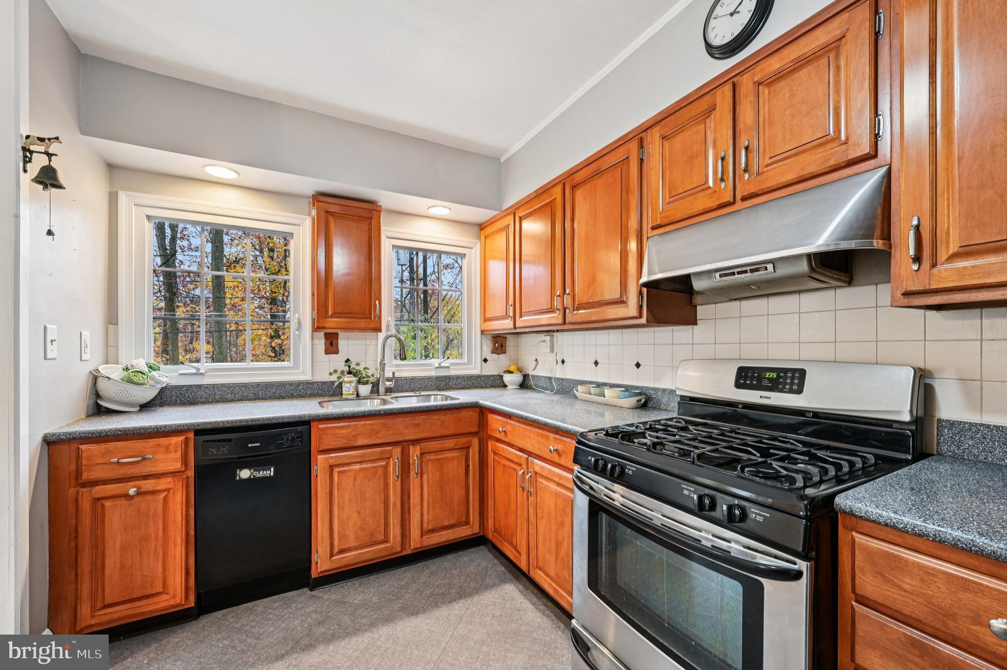19 Somerset Road Baltimore, MD 21228 - Photo 5 of 39 a kitchen with stainless steel appliances granite countertop a stove sink and cabinets