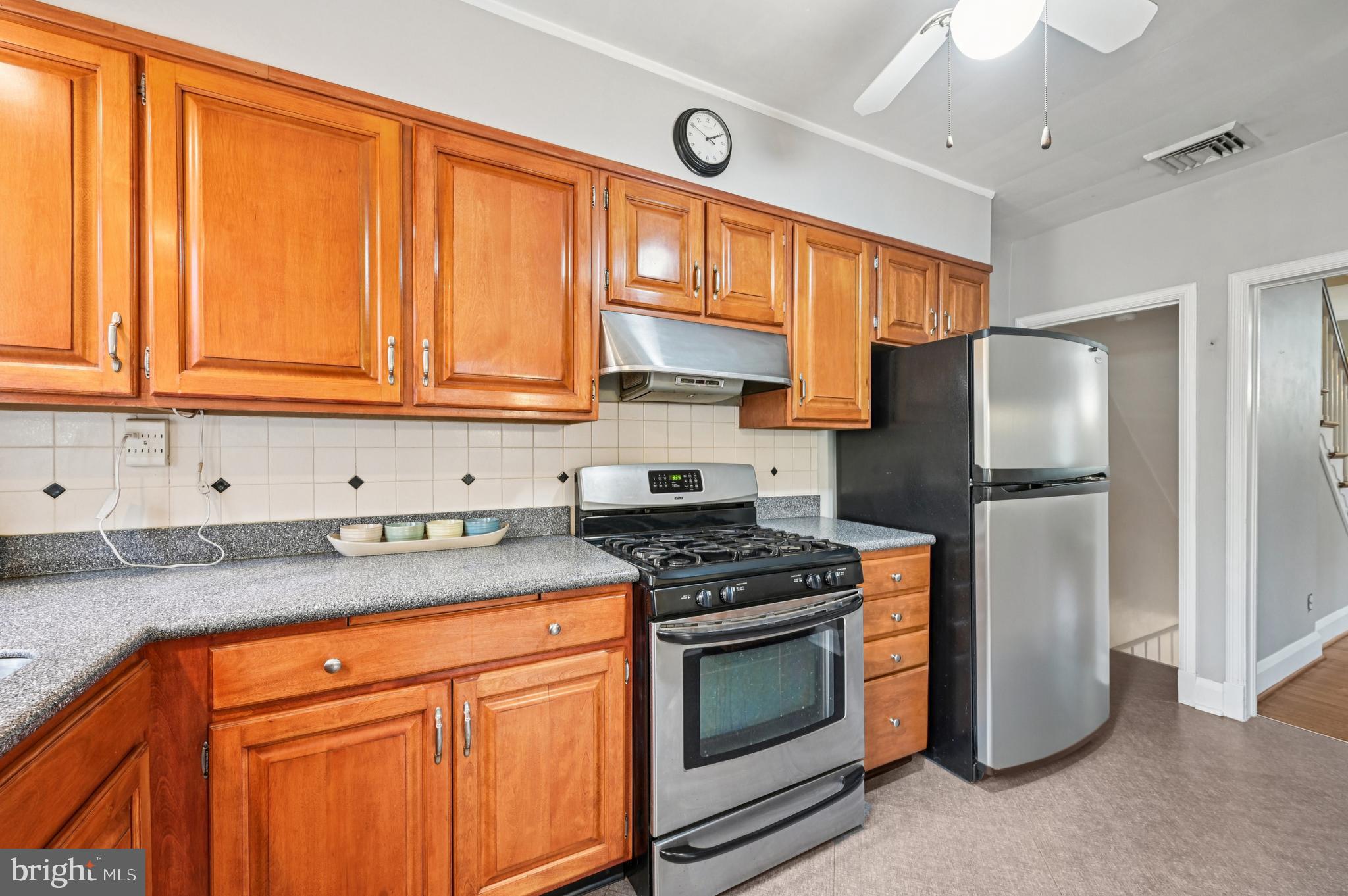19 Somerset Road Baltimore, MD 21228 - Photo 6 of 39 a kitchen with stainless steel appliances granite countertop a refrigerator stove and sink