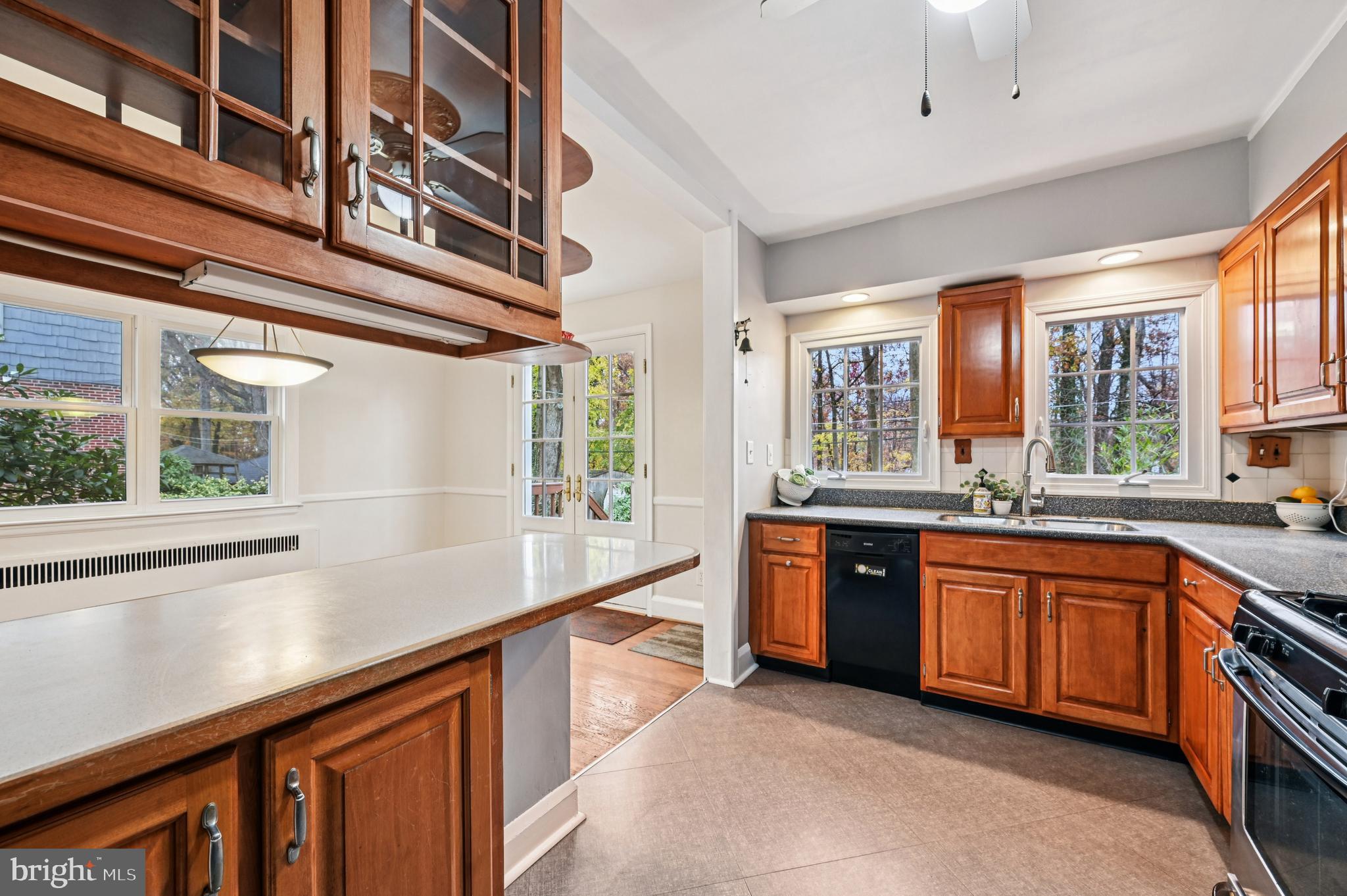 19 Somerset Road Baltimore, MD 21228 - Photo 7 of 39 a large kitchen with stainless steel appliances granite countertop a large window a sink and cabinets