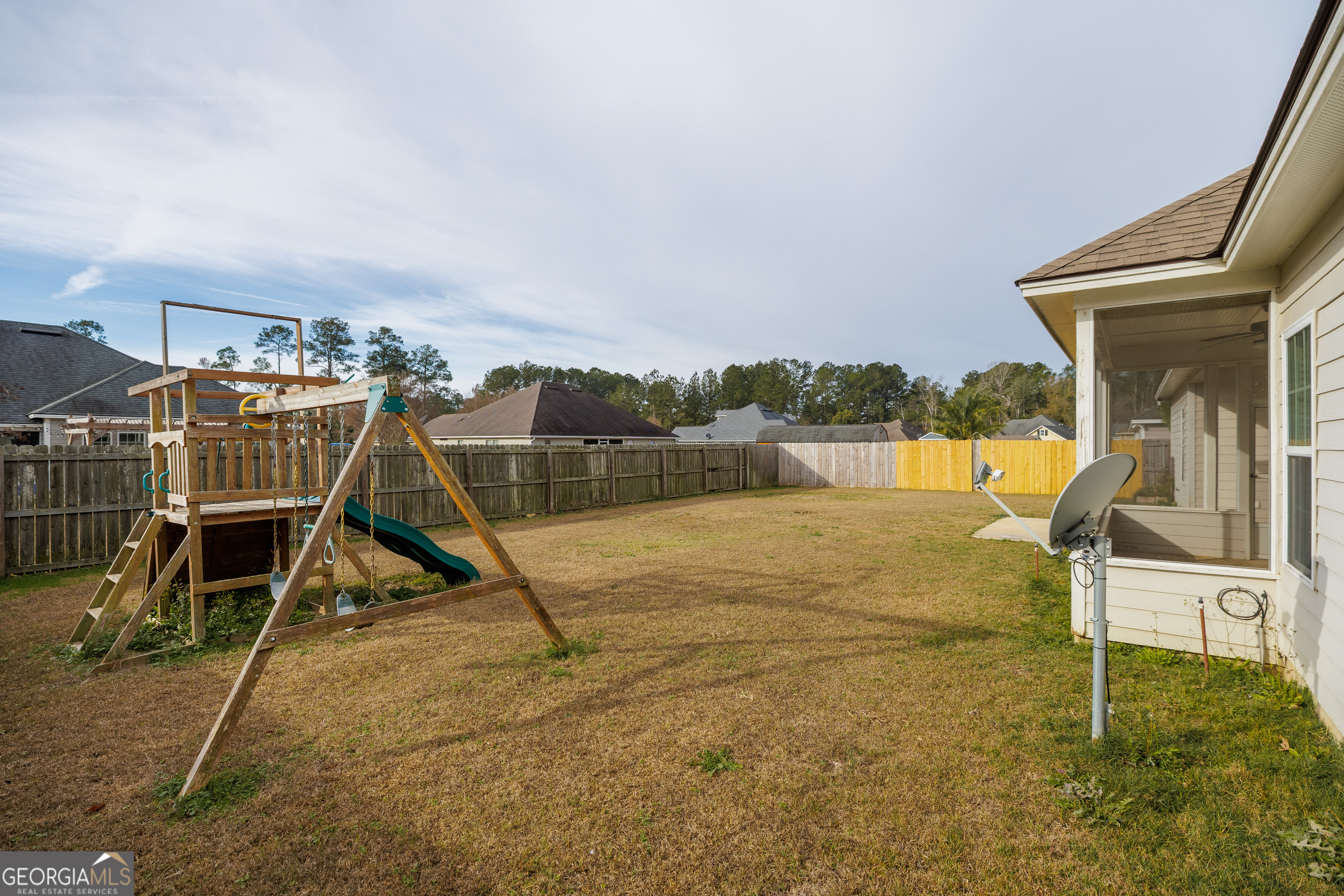 5109 Village Way Hahira, GA 31632 - Photo 42 of 42 a view of a swimming pool with a bench and wooden floor