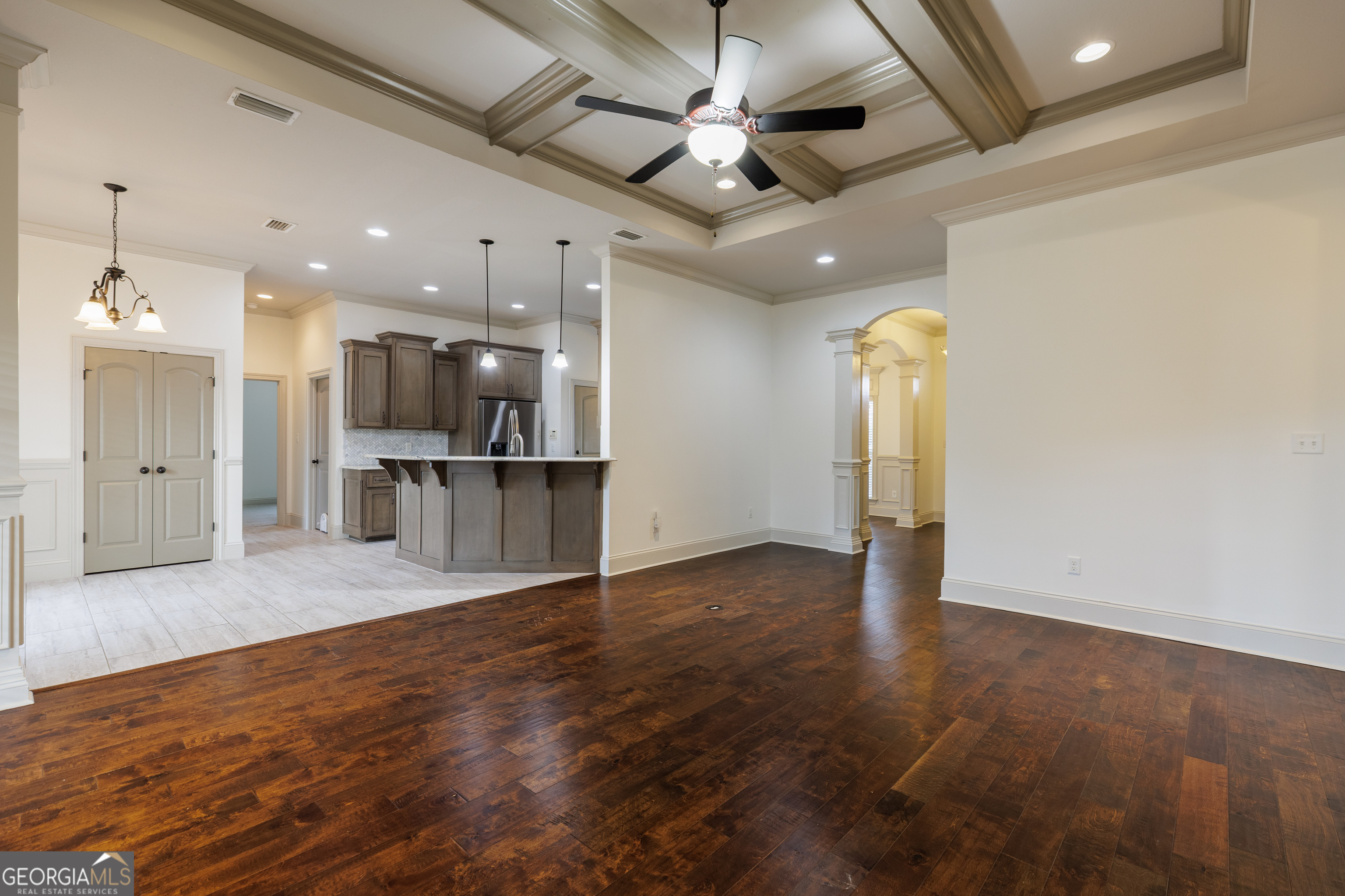 5109 Village Way Hahira, GA 31632 - Photo 7 of 42 a view of large hall with wooden floor and a kitchen