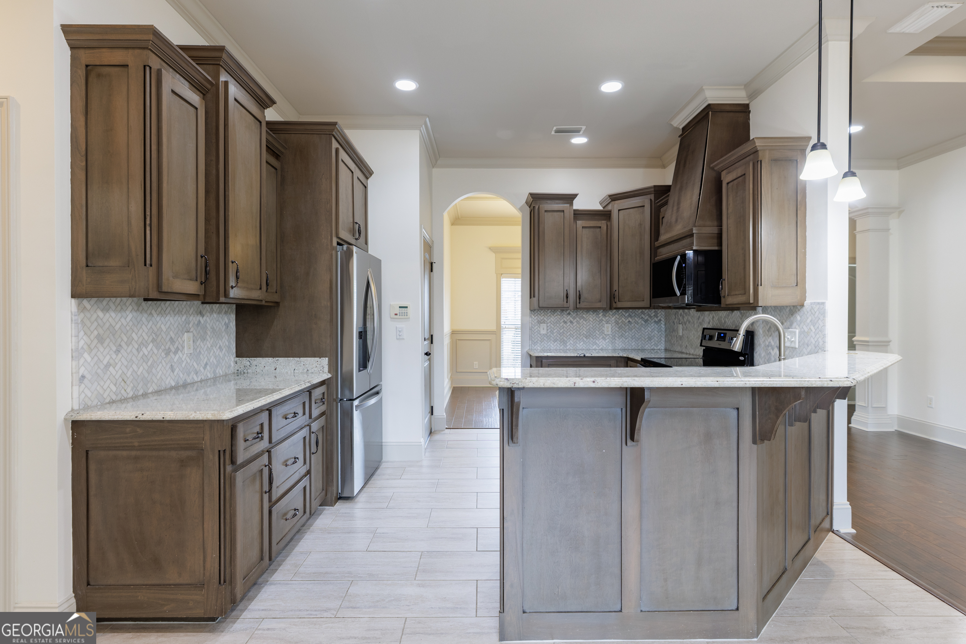5109 Village Way Hahira, GA 31632 - Photo 9 of 42 a kitchen with stainless steel appliances granite countertop a refrigerator a stove and a sink