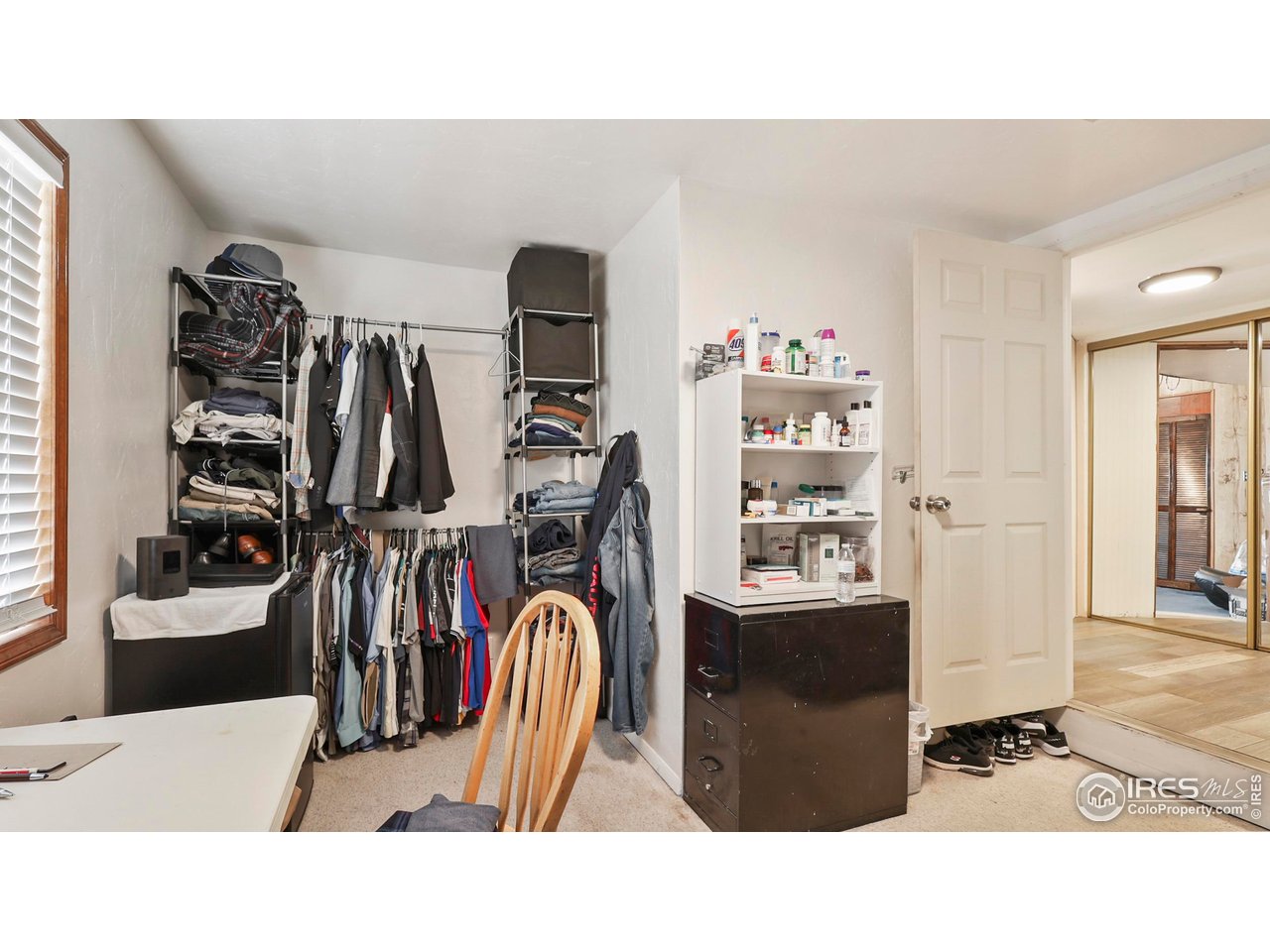 15985 Echo Road Fort Morgan, CO 80701 - Photo 13 of 22 a living room with lots of furniture and gym equipment