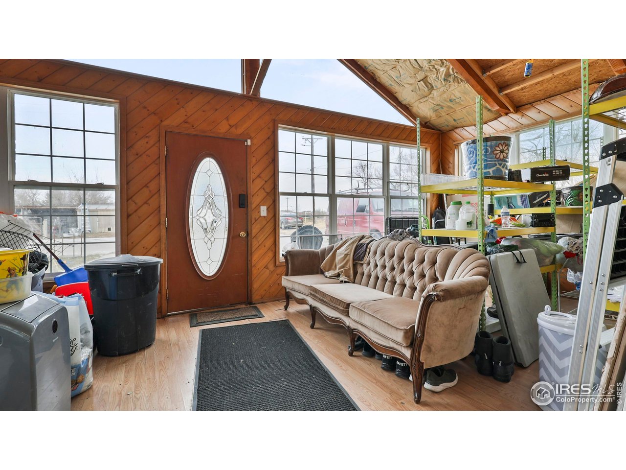 15985 Echo Road Fort Morgan, CO 80701 - Photo 19 of 22 a living room with a bed and a large window