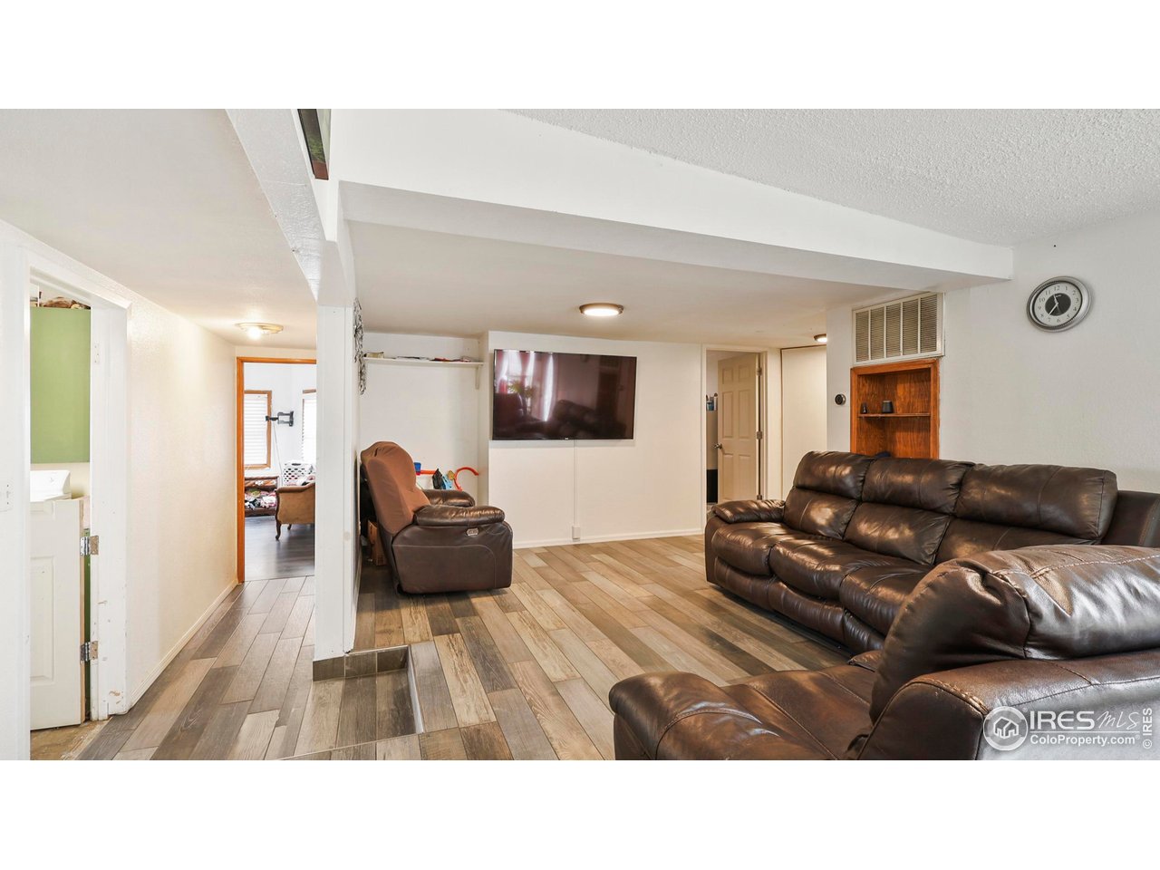 15985 Echo Road Fort Morgan, CO 80701 - Photo 3 of 22 a living room with furniture and a flat screen tv