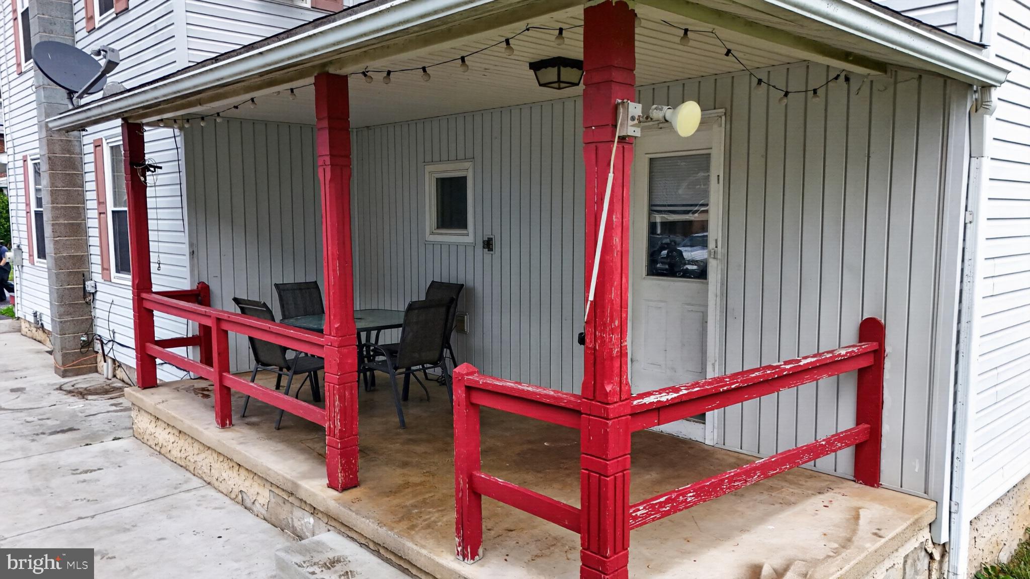 14 North Kinzer Road Kinzers, PA 17535 - Photo 23 of 34 Charming porch with vibrant red accents.