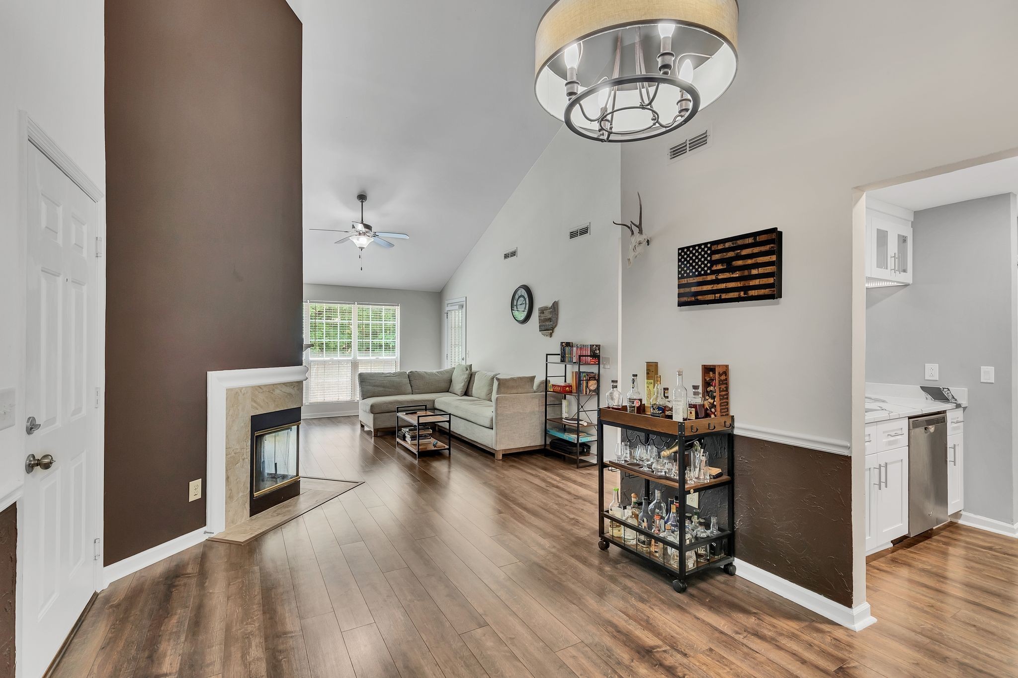 a living room with furniture and a fireplace