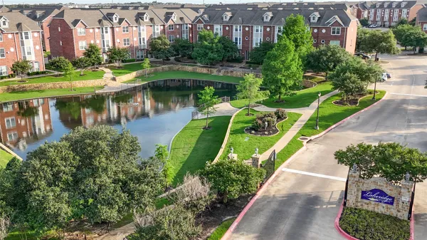 a view of a lake with a yard