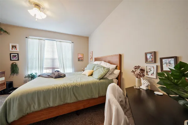 a bedroom with a bed outdoor view and a window