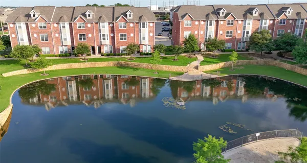 a view of a lake with a building in the background