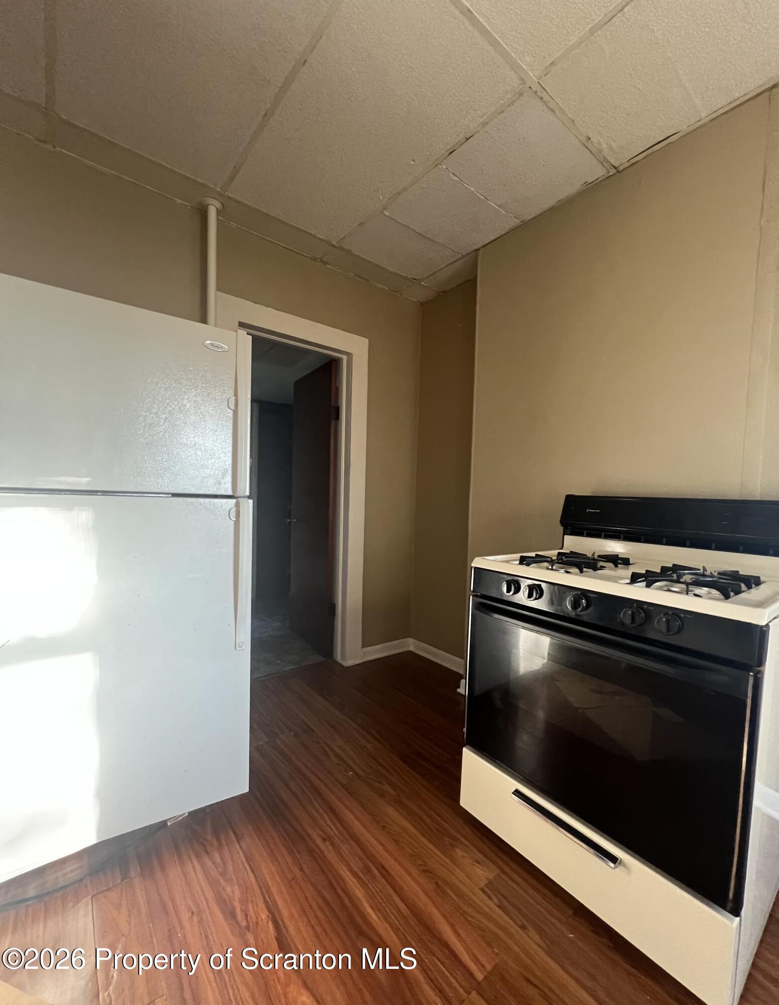 812 Butler Street Dunmore, PA 18512 - Photo 4 of 15 a stove top oven sitting inside of a kitchen