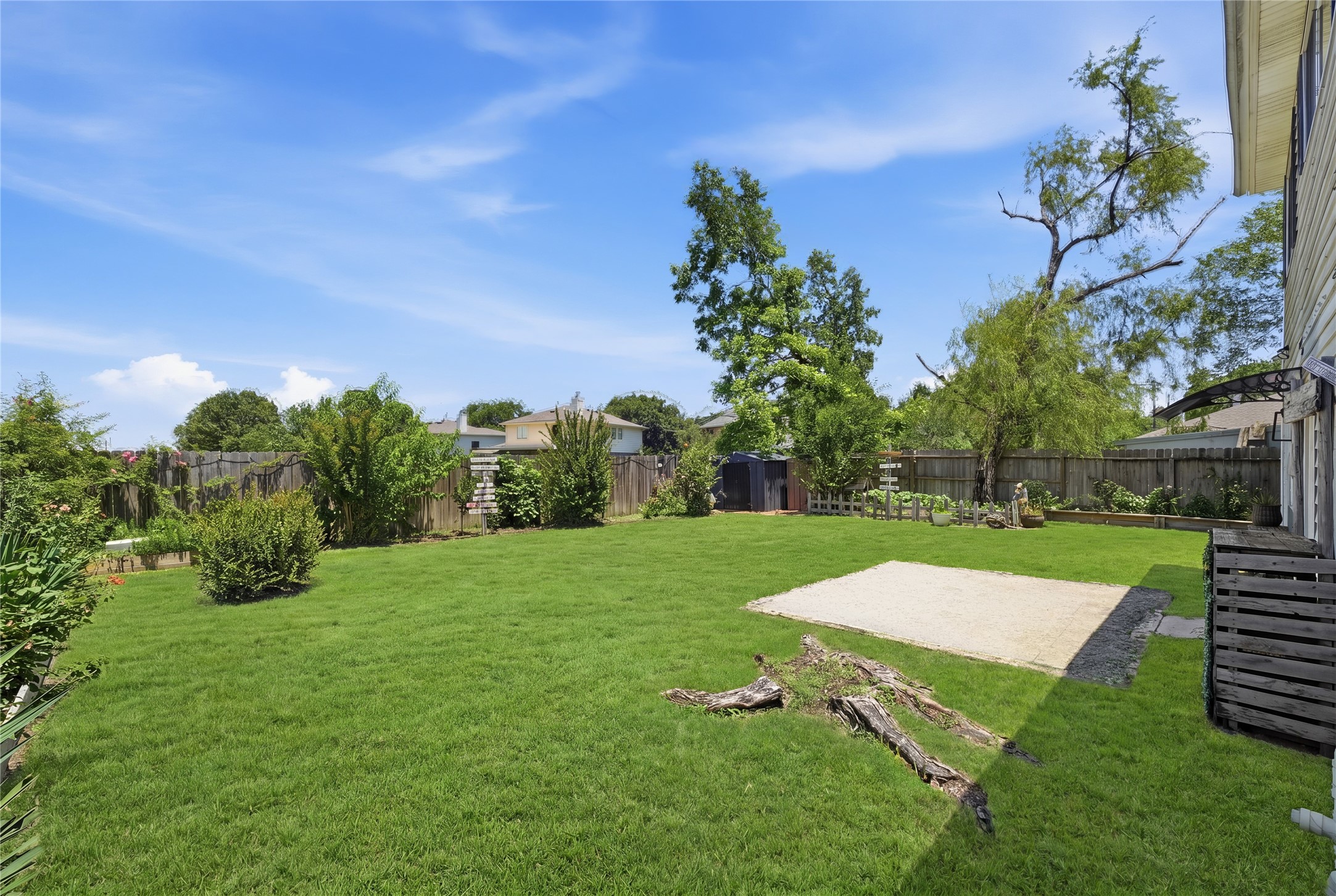 4718 Temple Bell Drive Spring, TX 77388 - Photo 39 of 50 Spacious backyard with lush green lawn, mature trees, and a well-maintained fence, perfect for outdoor activities and relaxation.