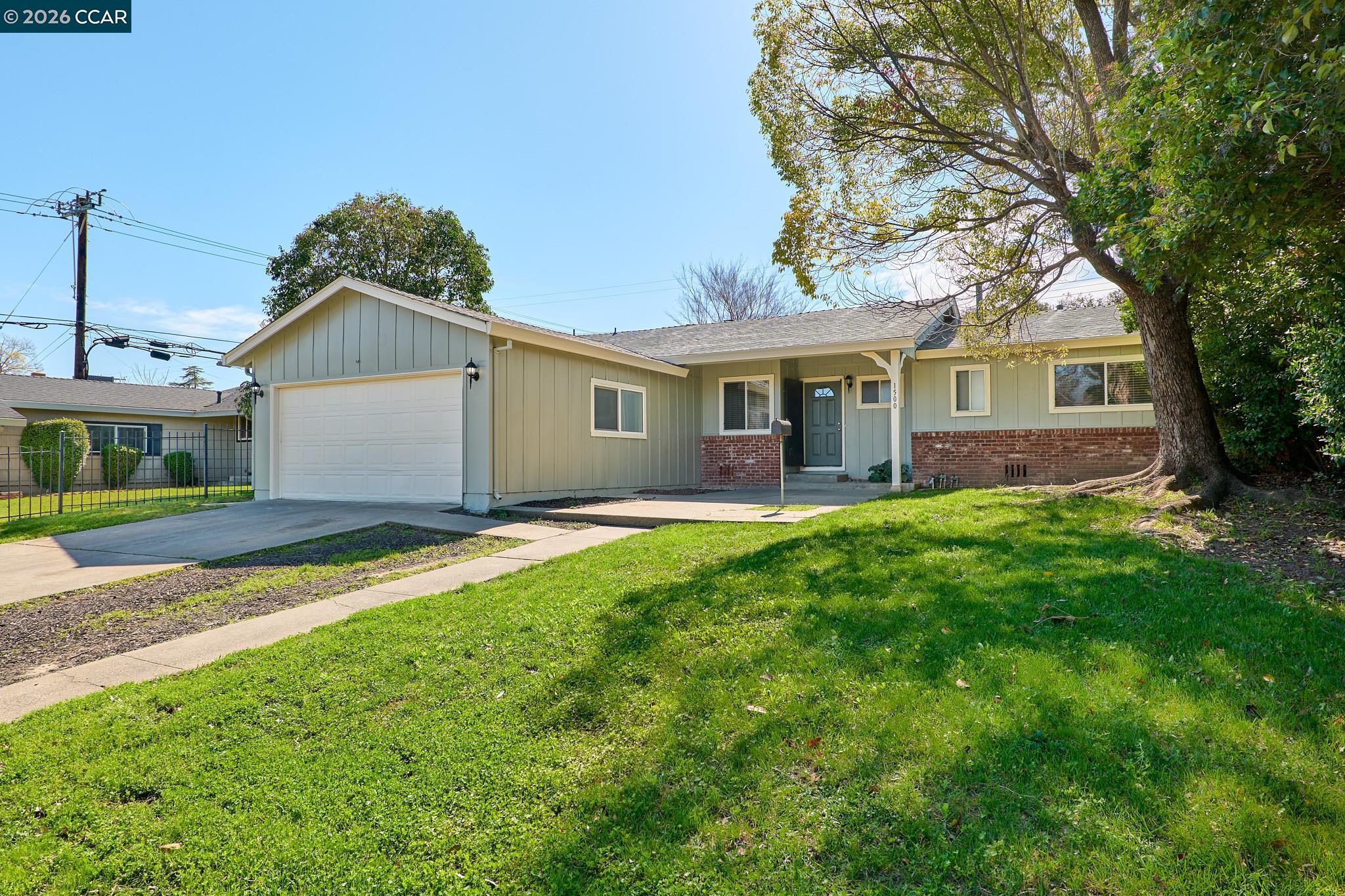 1500 Florin Road Sacramento, CA 95822 - Photo 1 of 1 a front view of house with yard and green space