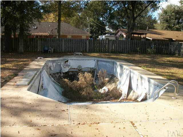 4773 Santa Rosa Drive Pace, FL 32571 - Photo 12 of 21 needs to be cleaned and pool liner.