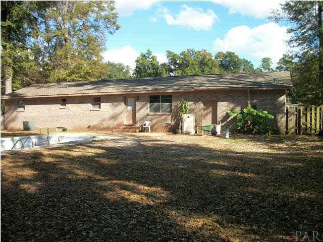 4773 Santa Rosa Drive Pace, FL 32571 - Photo 17 of 21 at the back of the yard looking to ward home. huge yard.