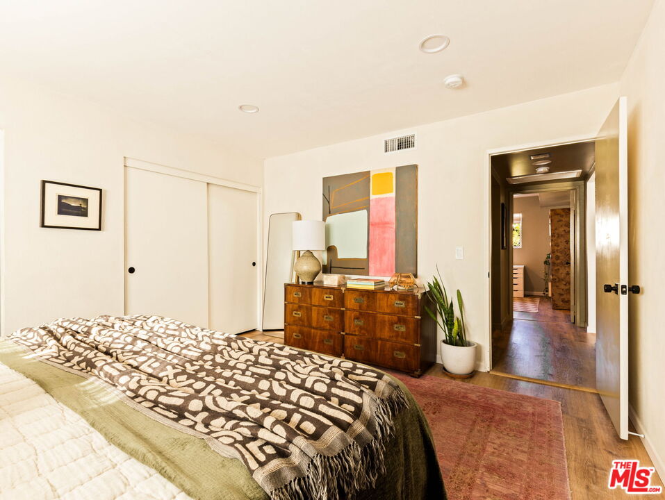 3015 Division Street, Unit 219 Los Angeles, CA 90065 - Photo 12 of 23 a bedroom with a large bed and a dresser