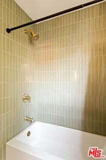 a bathroom with a shower and a bathtub