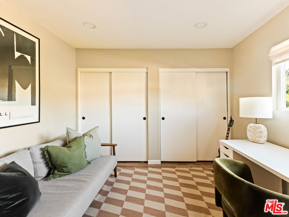 3015 Division Street, Unit 219 Los Angeles, CA 90065 - Photo 16 of 23 a bedroom with a bed and wooden floor