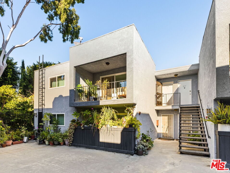 3015 Division Street, Unit 219 Los Angeles, CA 90065 - Photo 23 of 23 a front view of a house with a garden