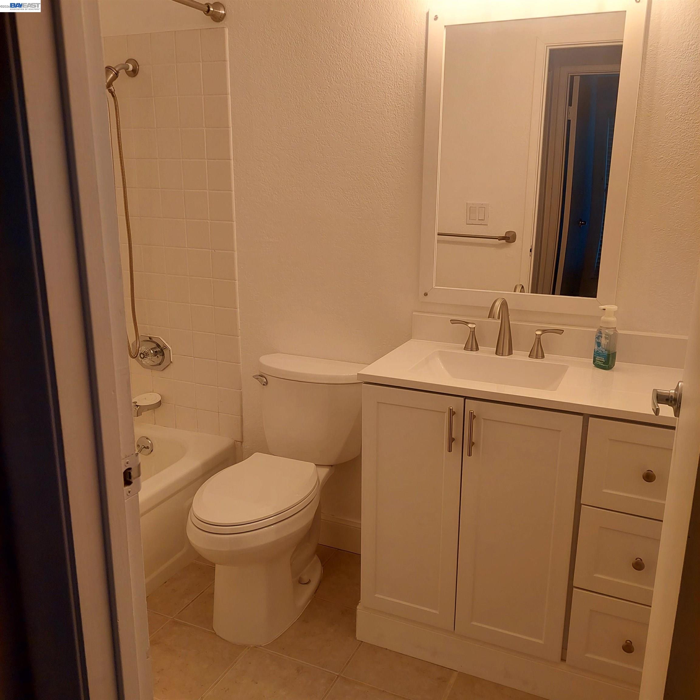 1544 Bailey Road, Unit 3 Concord, CA 94521 - Photo 4 of 10 a bathroom with a sink toilet and vanity