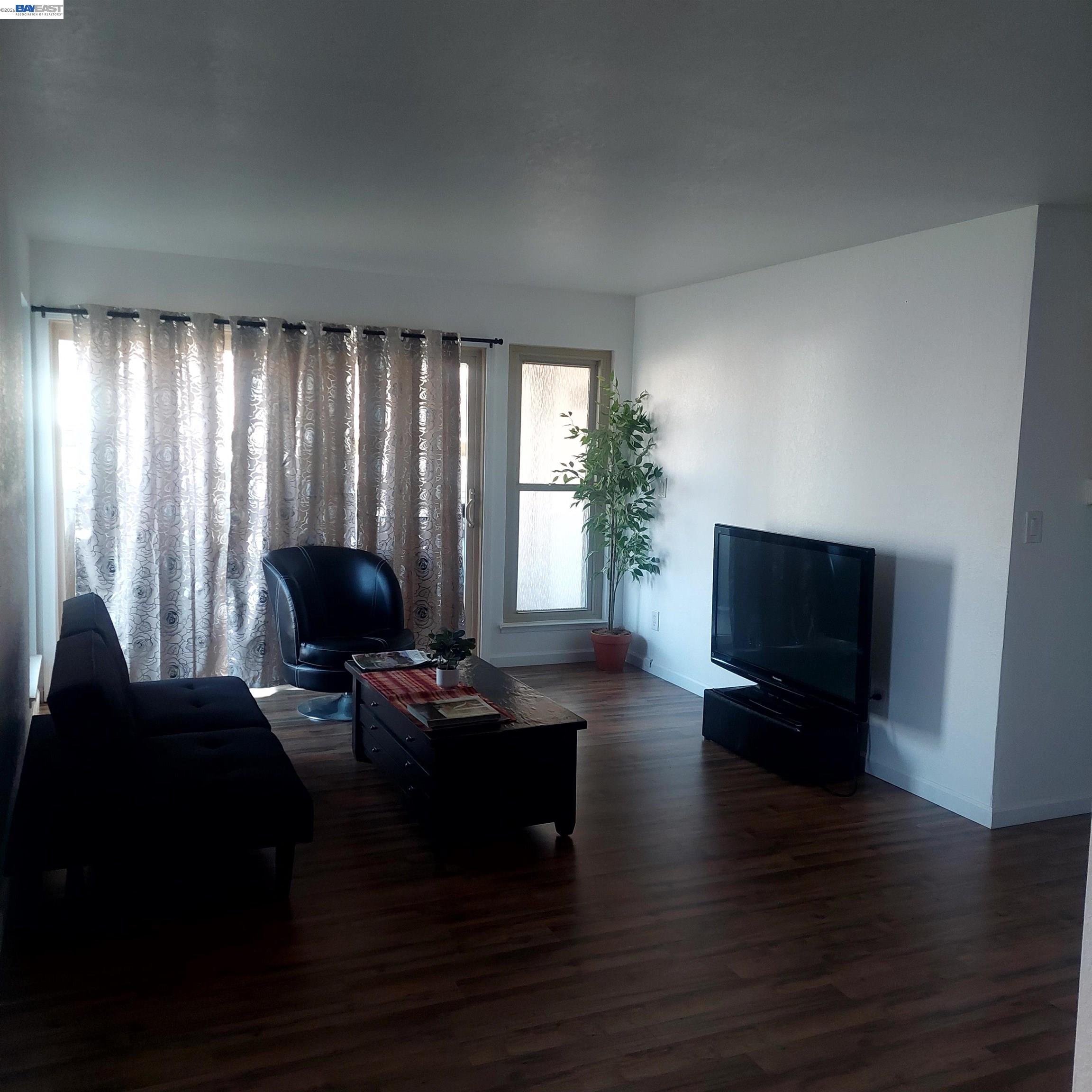 1544 Bailey Road, Unit 3 Concord, CA 94521 - Photo 6 of 10 a living room with furniture and a flat screen tv