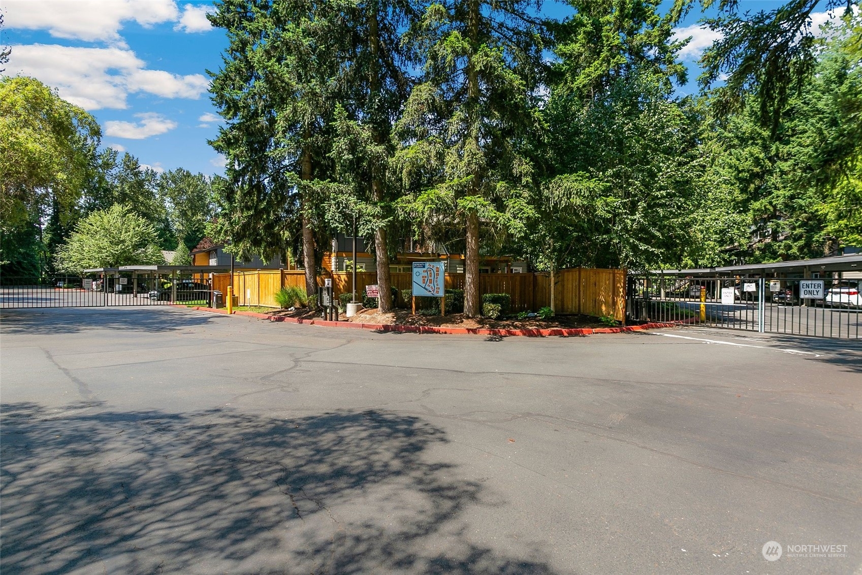 10822 Northeast 148th Lane, Unit J101 Bothell, WA 98011 - Photo 19 of 22 a view of street with parked cars