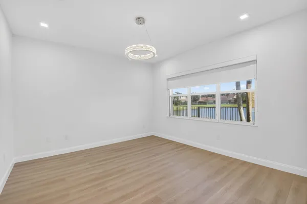 an aerial view of residential houses with outdoor space and river