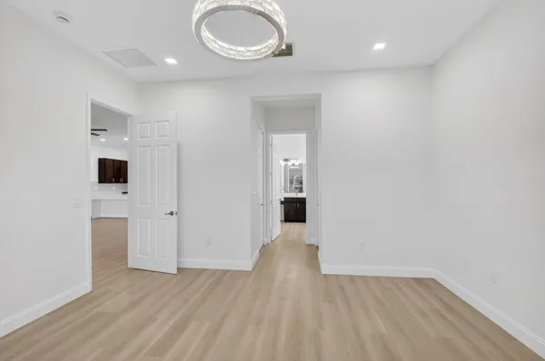 an aerial view of residential houses with outdoor space and lake view