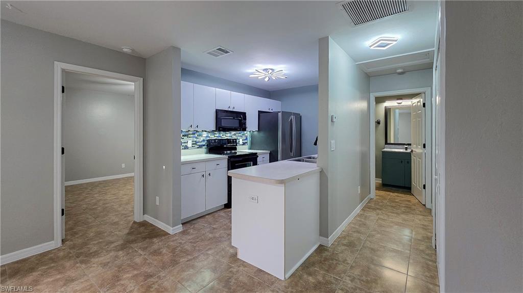 7319 Albany Road Fort Myers, FL 33967 - Photo 10 of 27 a view of a kitchen with a sink